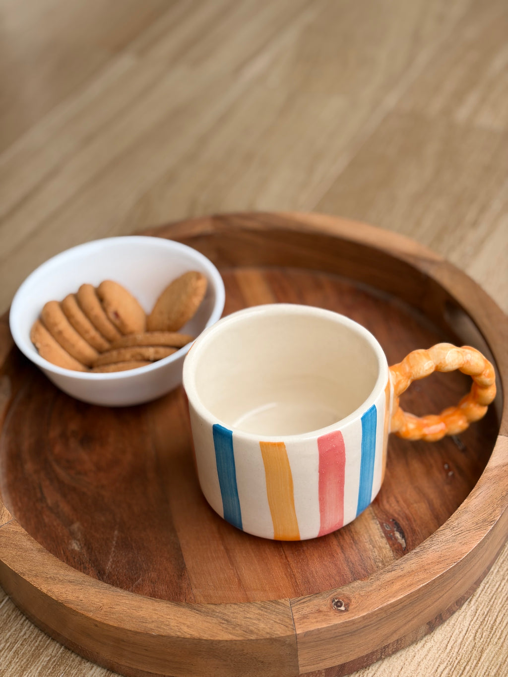 Colourful striped Orange handle mug