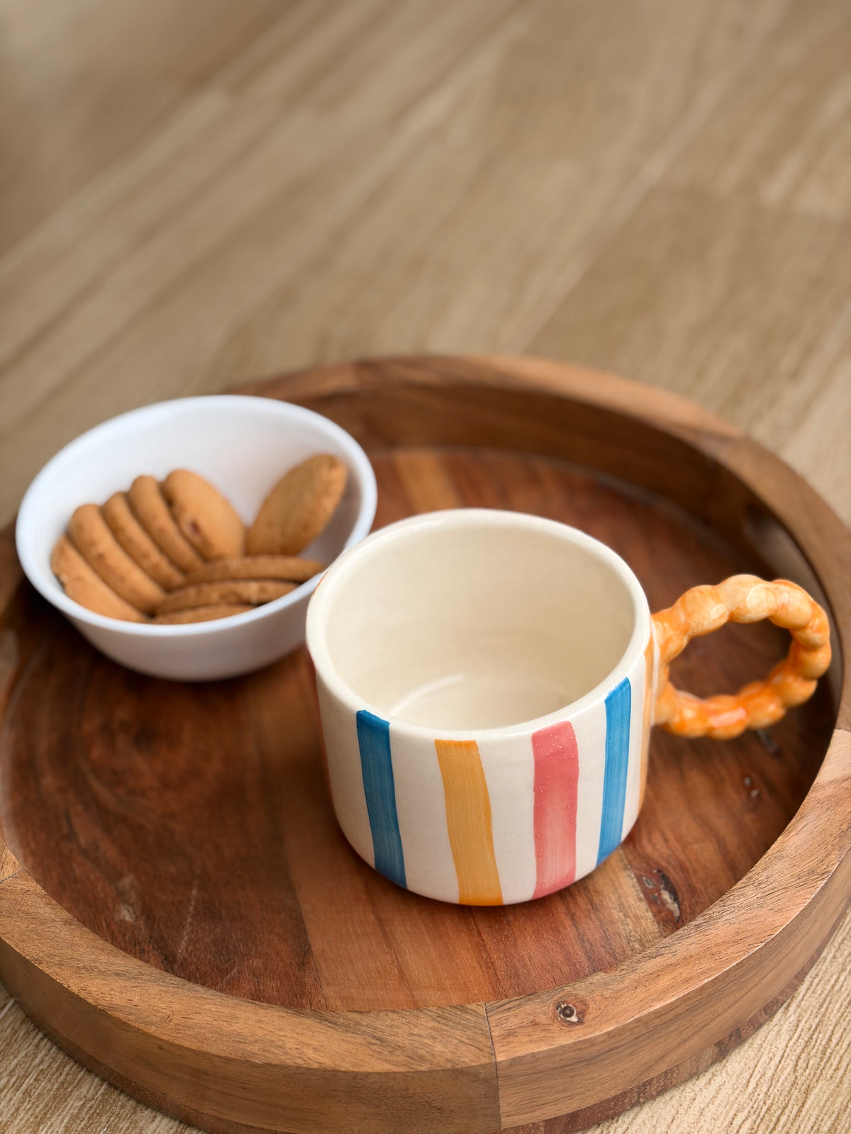 Colourful striped Orange handle mug