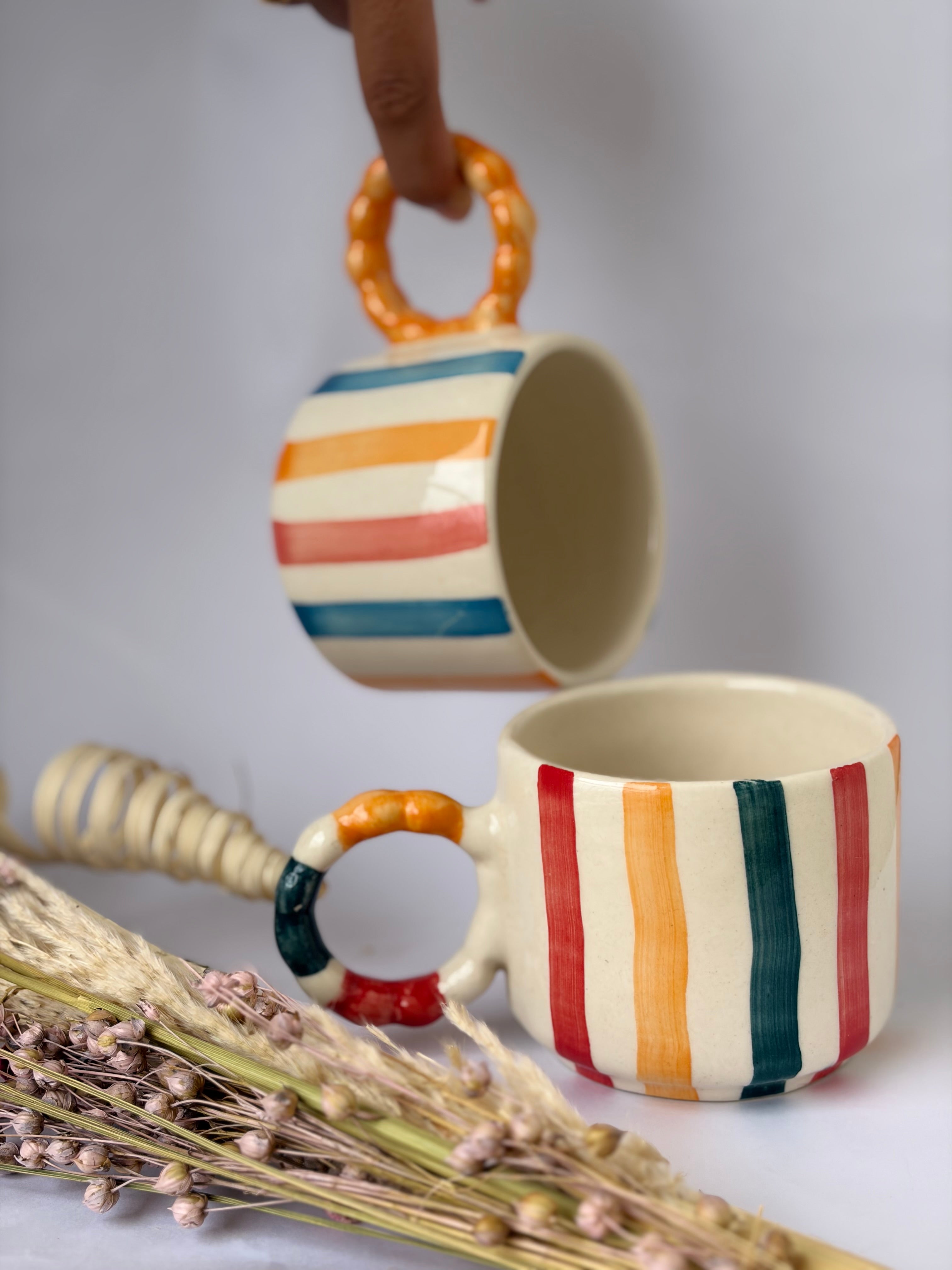 Colourful striped mug, colourful handle